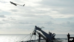 A Scan Eagle unmanned aerial vehicle launches from the flight deck of an amphibious assault ship. (File)