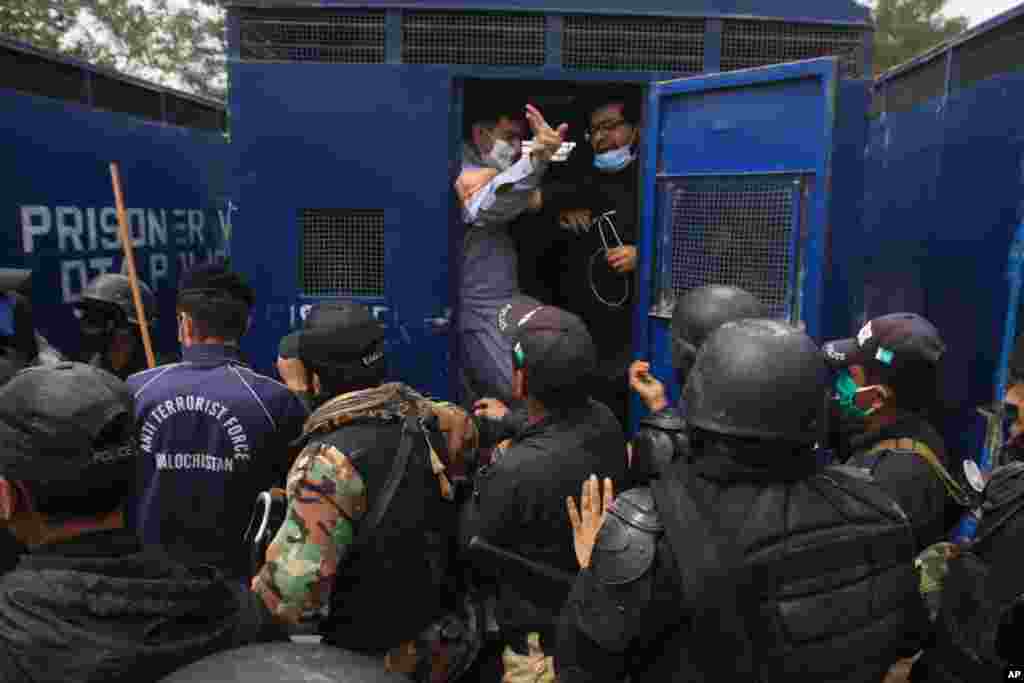 Police arrest doctors demanding facilities and prevention kits to take care of coronavirus patients, in Quetta, Pakistan.