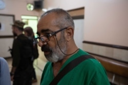 A doctor called Abu Hozan says he has been at his hospital for the past 10 days, sleeping only a few hours a night in an office short of equipment and medicine, in Qameshli, Syria, Oct. 20, 2019. (Yan Boechat/VOA)