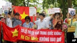 Protesters chant anti-China slogans during a demonstration in front of Hanoi Moi newspaper, a local daily of Vietnam's Communist Party, in Hanoi Aug. 14, 2011.