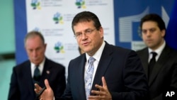 FILE - European Union Vice President Maros Sefcovic, center, speaks during a media conference at EU headquarters in Brussels, June 22, 2016