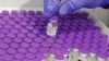 A healthcare worker prepares a dose of the Pfizer-BioNtech Covid-19 vaccine at a large vaccination center open by the Tel Aviv-Yafo Municipality and Tel Aviv Sourasky Medical Center on Dec. 31, 2020 in the Israeli coastal city.