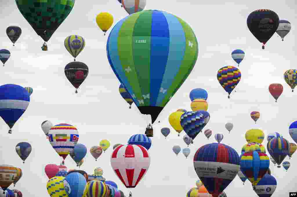 Hot-air balloons are seen at the Chambley-Bussieres airbase, near Hageville, eastern France, before the world record attempt of the biggest line with 456 balloons, as part of the &quot;Mondial Air Ballons.&quot;