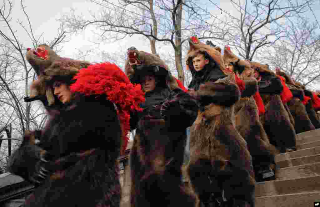 Youngsters wearing bear costumes dance during an annual ritual in Piatra Neamt, northern Romania.