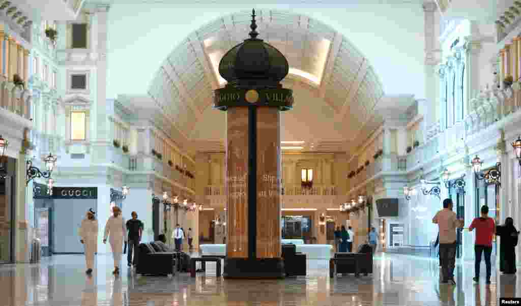 People walk inside Villagio Mall, located in a popular shopping area in Doha's west end September 20, 2012. The upscale mall had its first opening on Thursday since May 28, 2012, when at least 19 people were killed, including 13 children, in a fire that b