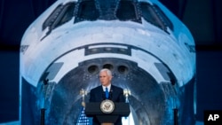 Vice President Mike Pence delivers opening remarks during the National Space Council's first meeting at the Smithsonian National Air and Space Museum's Steven F. Udvar-Hazy Center in Chantilly, Va., Oct. 5, 2017. 