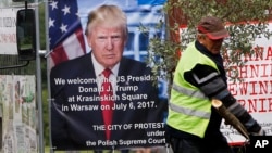 A poster advertising U.S. President Donald Trump's speech at the Krasinski Square on July 6, in Warsaw, Poland, July 4, 2017. 
