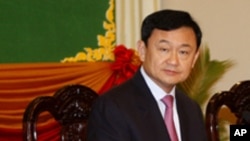 FILE - Thaksin Shinawatra, former Thai prime minister, Sept. 17, 2011.