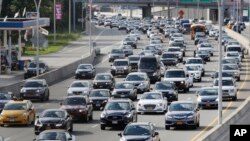 Cars are seen on the Grand Central Parkway pass LaGuardia Airport in New York, Aug. 1, 2018.