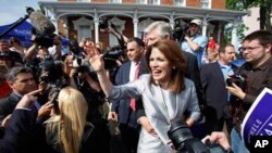 Rep. Michele Bachmann, R-Minn., waves to supporters after making her formal announcement to seek the 2012 Republican presidential nomination in Waterloo, Iowa. Bachmann, who was born in Waterloo, will continue her announcement tour this week with stops in
