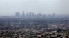FILE - Smog covers downtown Los Angeles, April 28, 2009.