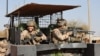 FILE - French soldiers of the Barkhane force patrol the streets of Timbuktu, northern Mali, Dec. 5, 2021. France's anti-jihadist military force in the Sahel region, which involves over 5,000 troops, will end in the first quarter of 2022.