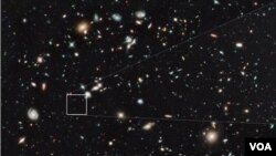 The farthest and one of the very earliest galaxies ever seen in the universe appears as a faint red blob in this ultra-deep–field exposure taken with NASA's Hubble Space Telescope. This is the deepest infrared image taken of the universe. Based on the obj