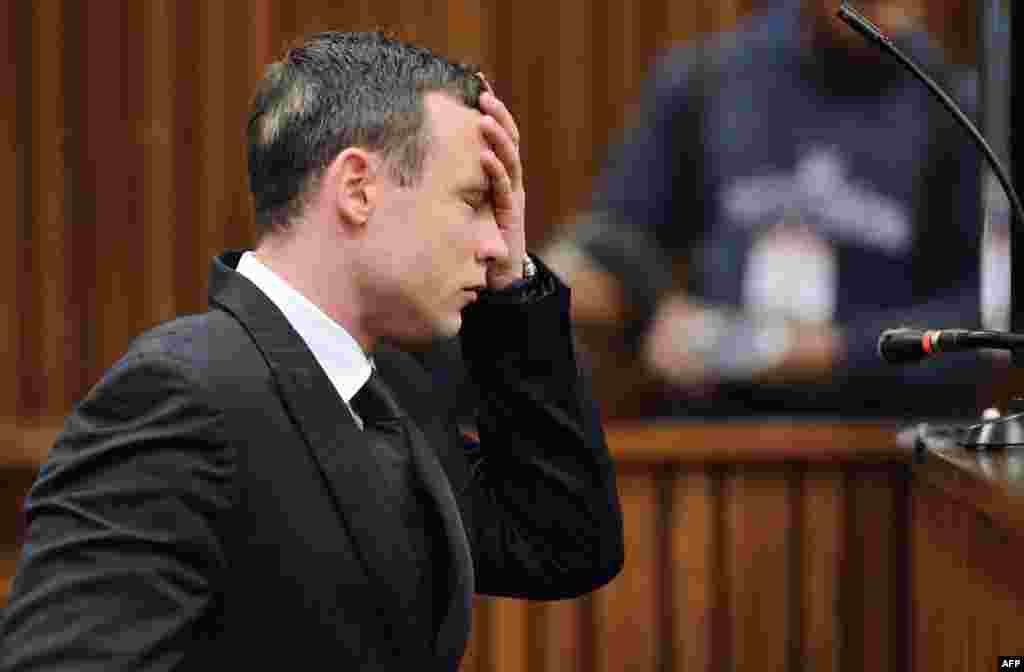 South African Paralympic athlete Oscar Pistorius sits in the dock at the High Court in Pretoria after spending 30 days under psychiatric observation to determine if he should be held criminally responsible for the killing of his girlfriend Reeva Steenkamp.