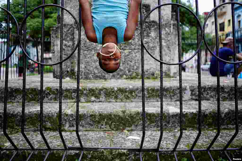 Yandel Pluma, 8, plays in a park in Havana, Cuba, June 11, 2018.