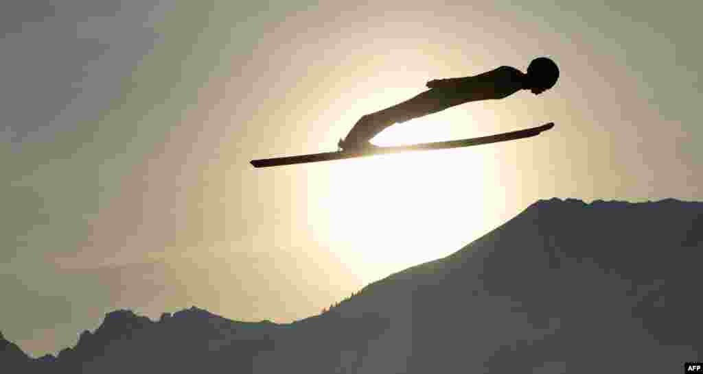 Ryoyu Kobayashi of Japan soars through the air during his training jump at the first stage of the Four-Hills Ski Jumping tournament (Vierschanzentournee), in Oberstdorf, southern Germany, Dec. 29, 2018.