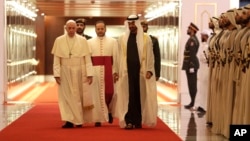 Pope Francis is welcomed by Abu Dhabi's Crown Prince Sheikh Mohammed bin Zayed Al Nahyan, upon his arrival at the Abu Dhabi airport, United Arab Emirates, Feb. 3, 2019. 