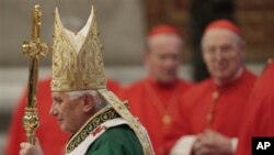 Pope Benedict XVI walks with his pastoral staff as he celebrates mass at the conclusion of the synod of bishops on the Middle East in St. Peter's Basilica at the Vatican, 24 Oct 2010