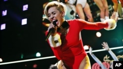 Miley Cyrus performing as part of the Power 96.1's Jingle Ball 2013 at Philips Arena on Dec. 11, 2013, in Atlanta. 