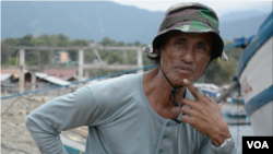 Macario Sepulveda, captain of the Prince John Paul fishing vessel, says his ship does do not go closer than a 55-kilometer radius from the Scarborough Shoal, March 24, 2014. (Simone Orendain/VOA)