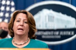 Deputy Attorney General Lisa Monaco speaks during a news at the Department of Justice in Washington, Oct. 26, 2021.