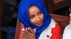 FILE - Rep. Ilhan Omar, D-Minn., listens to President Donald Trump's State of the Union speech, at the Capitol in Washington, Feb. 5, 2019.