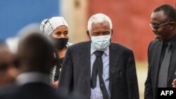 FILE - The second President of Tanzania Hassan Mwinyi (2nd R) attends the farewell mass for the late Tanzanian President John Magufuli before the burial at Magufuli Stadium in Chato, Tanzania, on March 26, 2021.