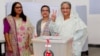 Prime Minister Sheikh Hasina gestures after casting her vote in the morning during the general election in Dhaka, Bangladesh, Dec. 30, 2018.