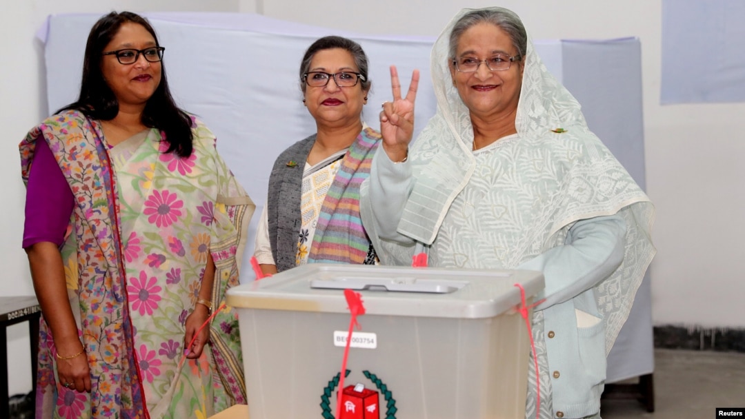 Prime Minister Sheikh Hasina gestures after casting her vote in the morning during the general election in Dhaka, Bangladesh, Dec. 30, 2018.