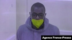  This video grab from an AFPTV video taken on Jan. 21, 2022 in Kampala, shows Kakwenza Rukirabashaija, a prominent Ugandan satirical writer and an outspoken government critic, appearing in court for a bail hearing via a video link from prison.
