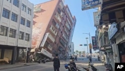In this image taken from a video footage run by TVBS, a partially collapsed building is seen in Hualien, eastern Taiwan on Wednesday, April 3, 2024. (TVBS via AP)