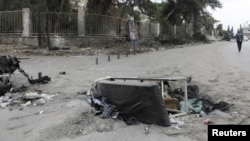 A man walks by a hospital bed in a street near Aleppo University Hospital, which was damaged by strikes after rebels staged a whirlwind advance over the past week, seizing Aleppo and much of the surrounding countryside, in Syria, Dec. 4, 2024.