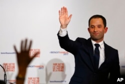 Benoit Hamon greets supporters after winning the Socialist party presidential nomination in Paris, France, Jan. 29, 2017.