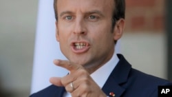 French President Emmanuel Macron gestures during a press conference with his Bulgarian counterpart Rumen Radev at the Euxinograd residence outside Varna, Bulgaria, Aug. 25, 2017. 