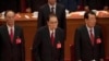 FILE - Former Chinese Premier Li Peng, center, attends the closing session of China's 19th Party Congress at the Great Hall of the People in Beijing, China, Oct. 24, 2017.