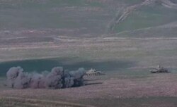 An image grab taken from a video made available on the official website of the Armenian Defense Ministry, Sept. 27, 2020, allegedly shows destroying of Azeri tanks during clashes between Armenian separatists and Azerbaijan.