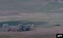 An image grab taken from a video made available on the official website of the Armenian Defense Ministry, Sept. 27, 2020, allegedly shows destroying of Azeri tanks during clashes between Armenian separatists and Azerbaijan.