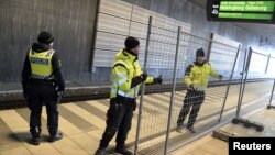 A temporary fence is erected between domestic and international tracks is seen at Hyllie train station in southern Malmo, Sweden, Jan. 3, 2016.