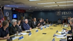 President Barack Obama visits the Federal Emergency Management Agency (FEMA) in Washington for an update on the recovery from Hurricane Sandy that hit New York and New Jersey especially hard earlier this week, November 3, 2012.