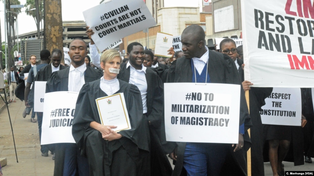 Lawyers take part in a protest outside the Constitutional Court after they presented a petition to the country’s chief justice Luke Malaba’s office in Harare, Zimbabwe, Jan. 29, 2019.