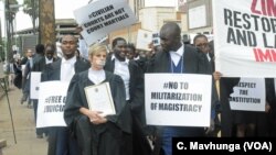 Lawyers take part in a protest outside the Constitutional Court after they presented a petition to the country’s chief justice Luke Malaba’s office in Harare, Zimbabwe, Jan. 29, 2019.