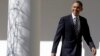 President Barack Obama looks towards reporters as he walks down the West Wing Colonnade of the White House on February 12, 2013, ahead of his State of the Union speech on Capitol Hill. 
