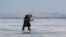 Lyubov Morekhodova, aged 79, skates on ice-covered Lake Baikal in Irkutsk Region, Russia January 29, 2021. 