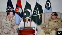In this photo released by Inter Services Public Relations, U.S. Chairman of the Joint Chiefs of Staff Adm. Mike Mullen, left, listens to Pakistan's Chairman Joint Chiefs of Staff Committee General Khalid Shameem Wynne during a meeting in Rawalpindi, Pakis