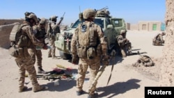 Afghan Special Forces prepare themselves for battle with the Taliban on the outskirts of Lashkar Gah capital of Helmand, Afghanistan, Oct. 10, 2016. 