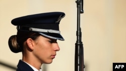 FILE - A female U.S. Air Force Airman First Class is part of an honor cordon that welcomed Qatar Minister of State for Defense Affairs Hamad bin Ali Al Attiyah to the Pentagon October 23, 2015 in Arlington, Virginia. 