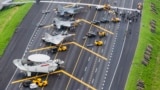 Taiwan war planes are parked on a highway during an exercise to simulate a response to a Chinese attack on its airfields in Changhua in southern Taiwan. (Military News Agency via AP, File)