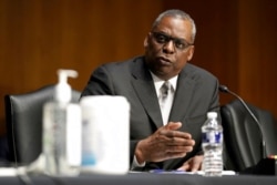 FILE - Secretary of Defense nominee Lloyd Austin, a recently retired Army general, speaks during his conformation hearing before the Senate Armed Services Committee on Capitol Hill, Jan. 19, 2021.