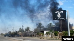 지난해 11월 이라크 바그다드 북부 사디야 지역에서 수니파 무장단체 ISIL과 이라크 군의 충돌이 있은 후 연기가 피어오르고 있다. (자료사진)