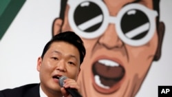 South Korean singer PSY answers a reporter's question during a news conference on the release of his seventh album in Seoul, South Korea, Nov. 30, 2015. 